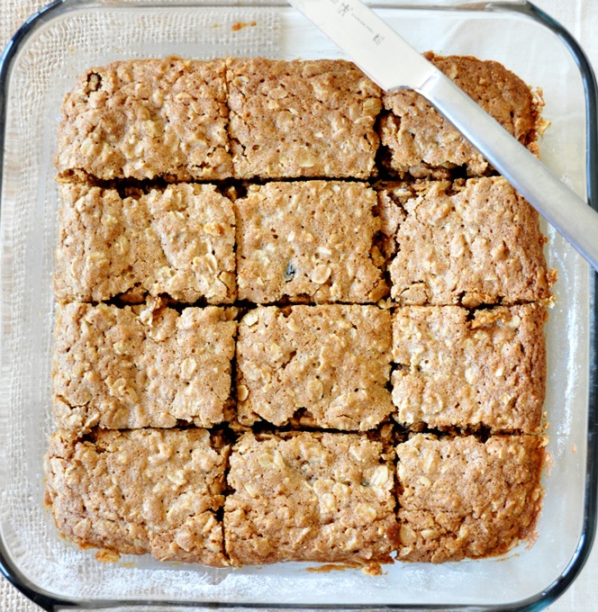 Glass baking dish of sliced Chai-Spiced Oatmeal Raisin Bars