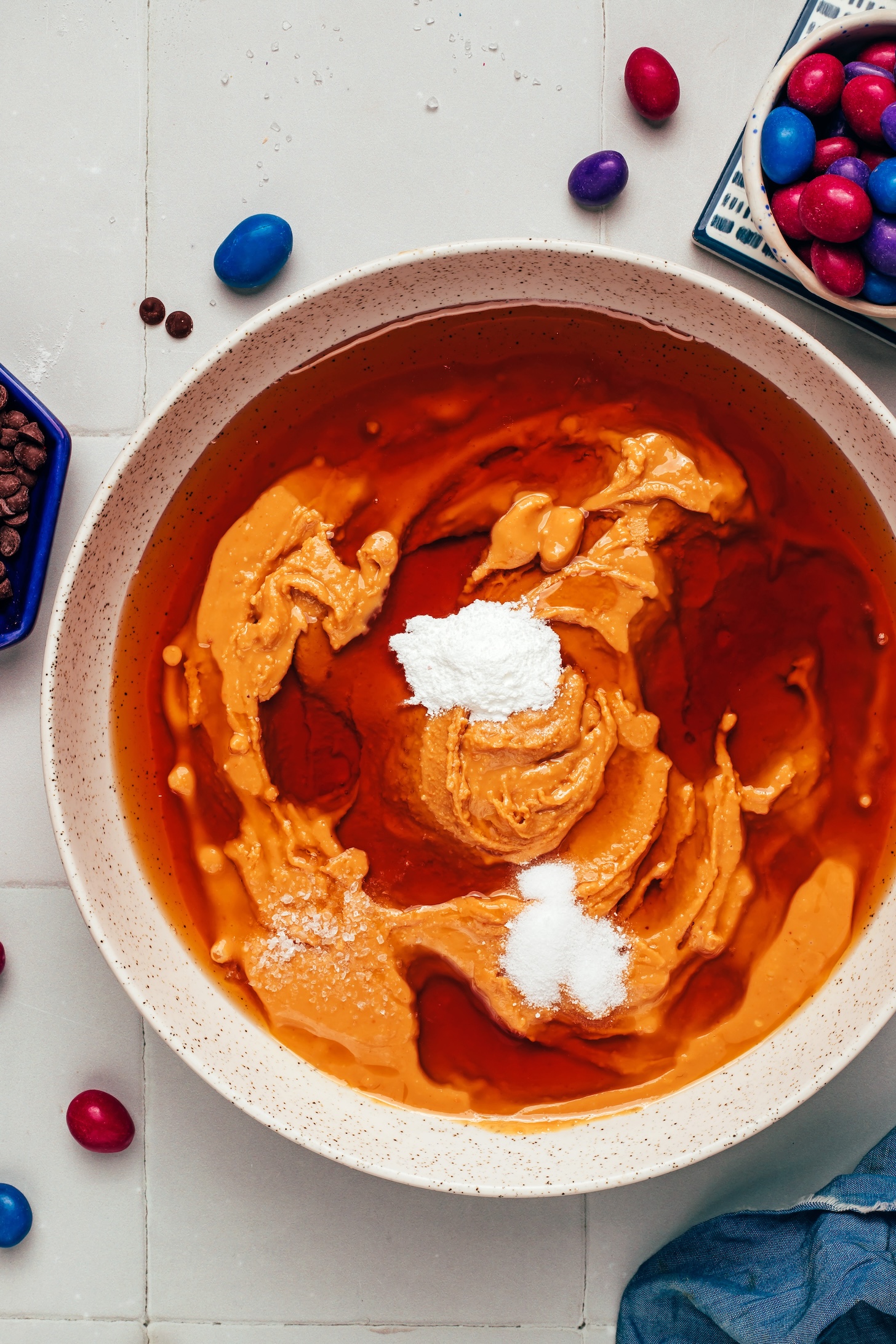 Bowl with peanut butter, maple syrup, vanilla extract, baking powder, baking soda, and salt