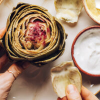 Showing how to eat an artichoke