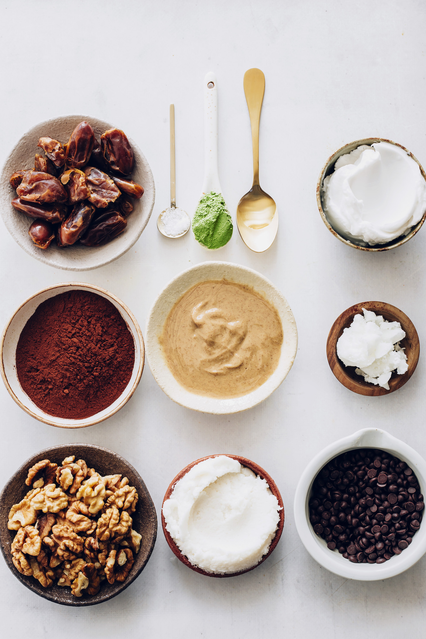 Dates, cocoa powder, walnuts, coconut butter, cashew butter, peppermint extract, coconut milk, coconut oil, moringa powder, salt, and chocolate chips