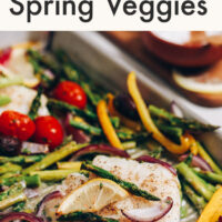 Sheet pan of easy baked cod with spring vegetables