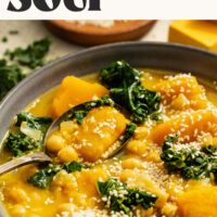 Spoon resting in a large bowl of our Kabocha Chickpea Miso Soup with text above that says 1 pot and 30 minutes