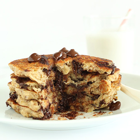 Stack of Chocolate Chip Oatmeal Cookie Pancakes with a slice removed