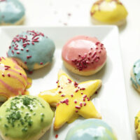 Plate of frosted sugar cookies for our round-up of easy 1-bowl holiday cookie recipes