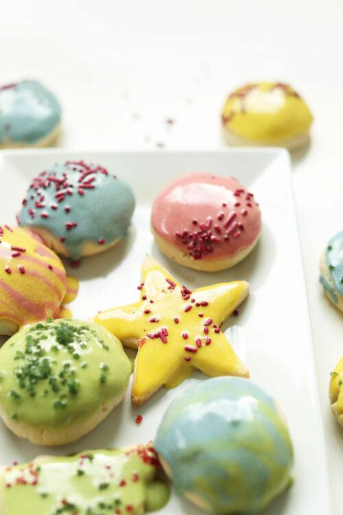 Plate of frosted sugar cookies for our round-up of easy 1-bowl holiday cookie recipes