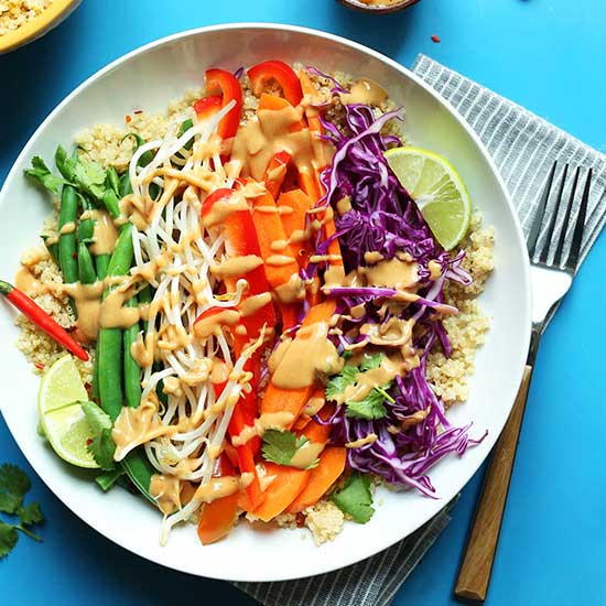 Big bowl of quinoa topped with vegetables for our Quinoa Gado Gado recipe