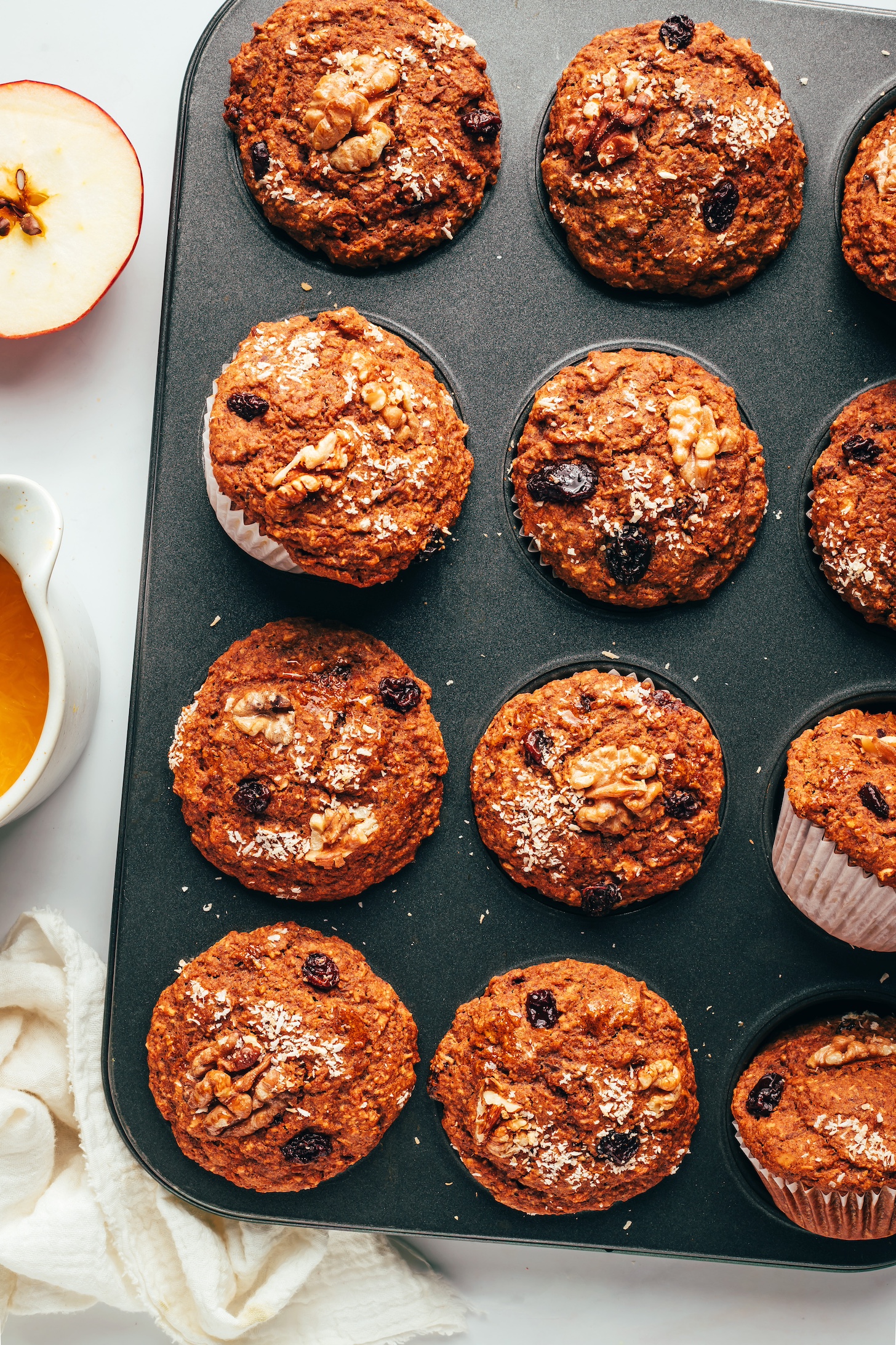 Muffin tin of baked vegan gluten-free morning glory muffins